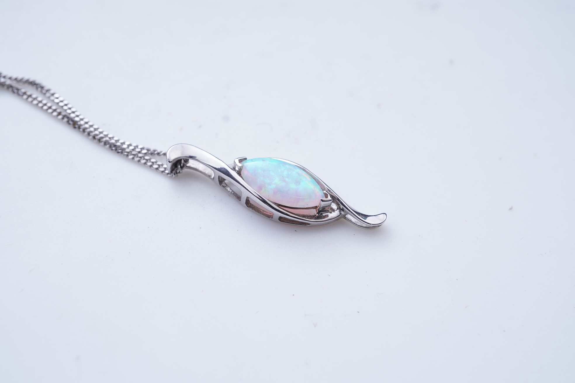 A synthetic opal demi-parure